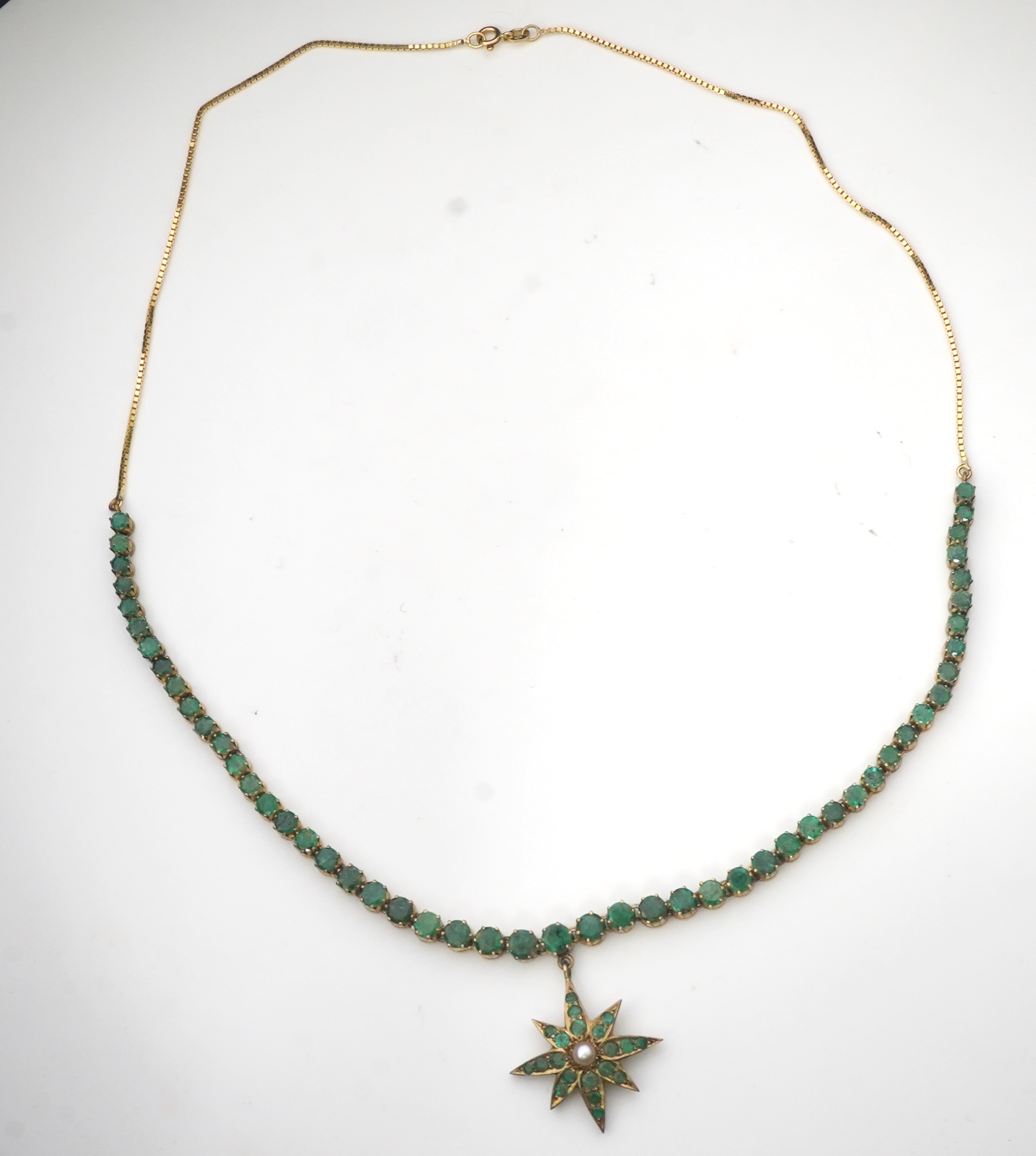 An emerald and pearl necklace